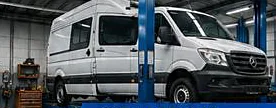 Van raised on a workshop ramp